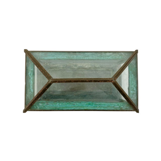 This is an antique terrarium made of glass and copper. It is from the late 19th early 20th century in the Arts & Crafts...