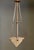 Art Deco pendant light with geometric motifs in the glass shade and metal fixture, which is in perfect condition. The...