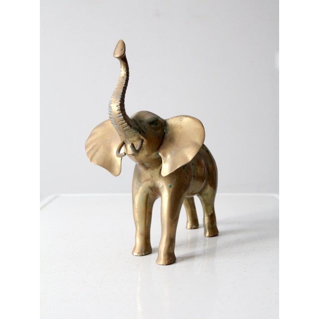 Add a touch of worldly charm with this vintage brass elephant. Its well-loved patina adds character to this timeless piece.