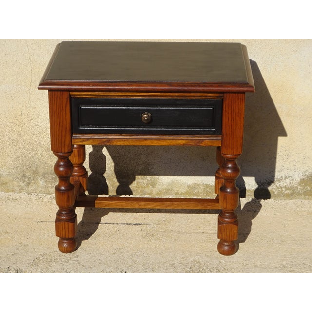 1980s bedside table with drawer. Wooden top with chamfered edges, painted matte black and varnished. One drawer with a...