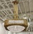Stunning French Art Deco chandelier created by the French artist Degue. In a square brass frame embrace a center shade...