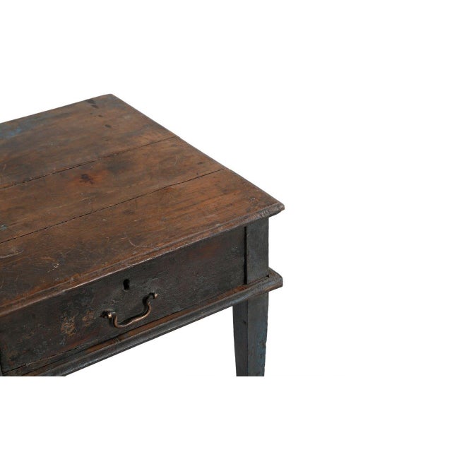 This Vintage Indian Teakwood Side Table is handcrafted from solid teakwood, featuring tapered legs and a convenient single...