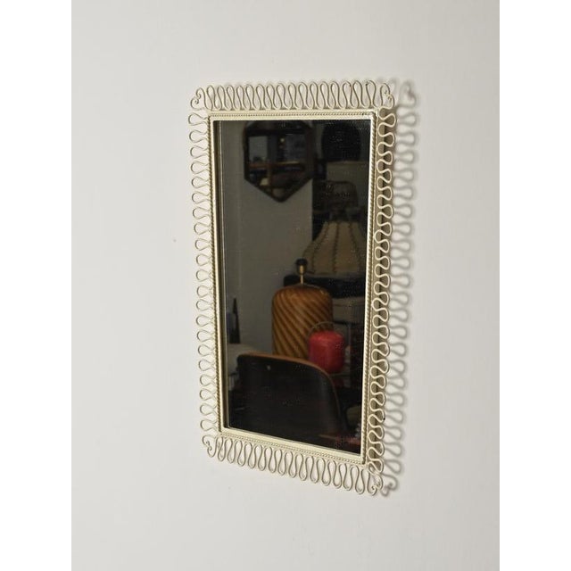Stunning wall mirror in wrought iron, enameled in ivory white. This incredibly elegant and unique mirror was produced in...