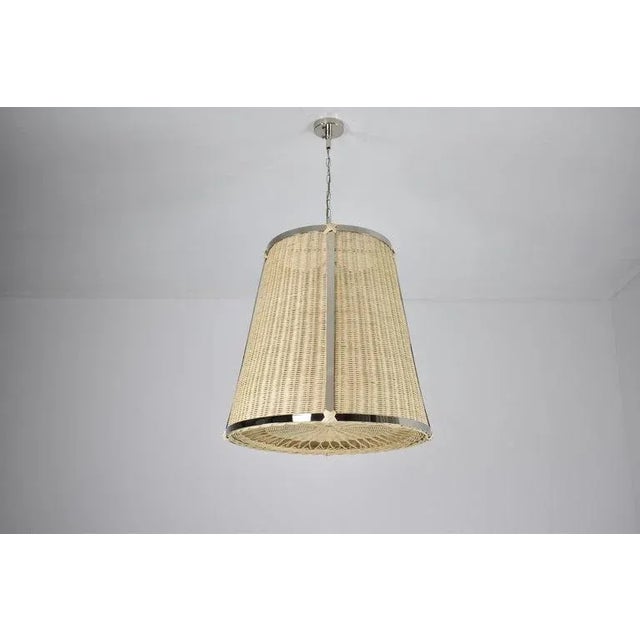 The Caeli-A contemporary handcrafted made-to-measure pendant light fixture features an expertly handcrafted nickel-plated...