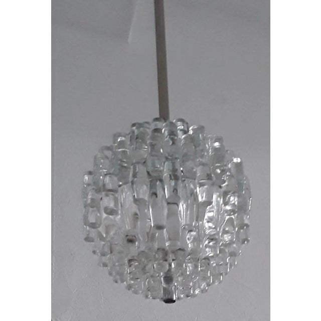 Vintage ceiling lamp with silver metal mounting, - rod and canopy with 2-piece profiled pressed glass shade from the 70s...