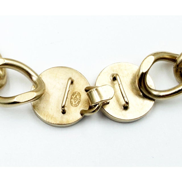 Chanel Gold CC Camellia Pink Button Chain Bracelet *Marked 06 *Made in Italy -It is approximately 7.25" x 0.5". -It is in...