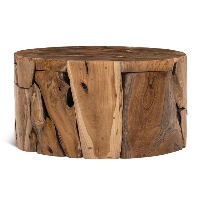 Organic modern design round block coffee table crafted from freeform teak fragments pieced together harmoniously. Each...