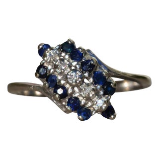 The Roscoe: Ladies White Gold Bypass Style Cocktail Ring set with Diamonds and Sapphires For Sale