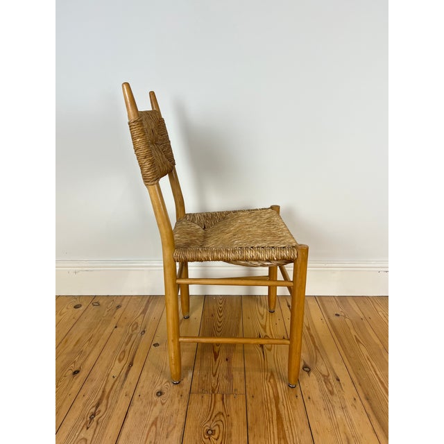Charlotte Perriand style dining chair dating from the 1960s-70s, sourced from Europe. Maker/designer unknown. Thick woven...