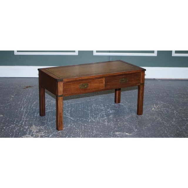 Harrods London Kennedy Military campaign coffee table with a brown leather top. We have lightly restored this by cleaning...