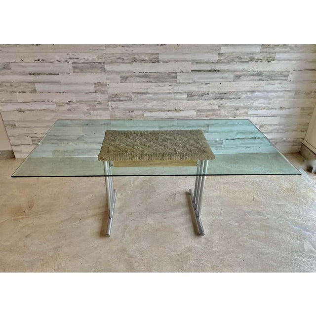 Tubular chrome with rush panel under the glass top vintage table base.
