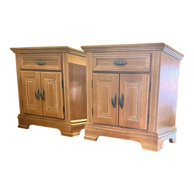 Elevate your bedroom with this exceptional matching pair of vintage nightstands/bedside cabinets by Wynwood Furniture....