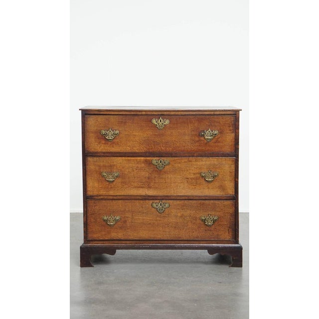 Offered this uniquely beautiful antique English chest of drawers from the 18th century with 3 drawers and original...