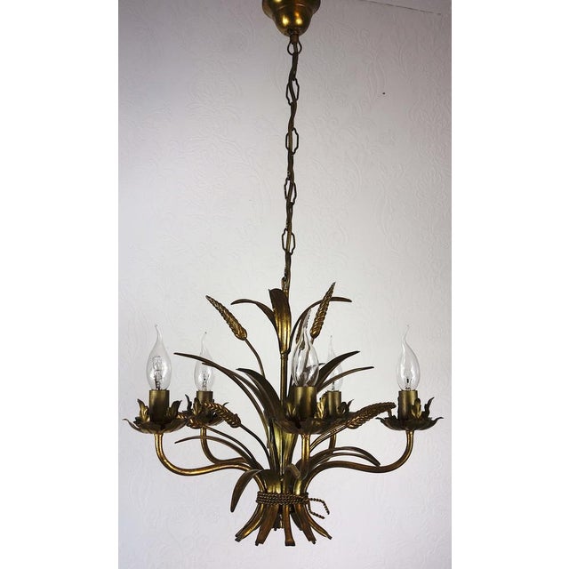 Hollywood Regency Gold Plated Metal Chandelier, 1960s, in Very Good conditions. Designed 1960 to 1969 I have official...