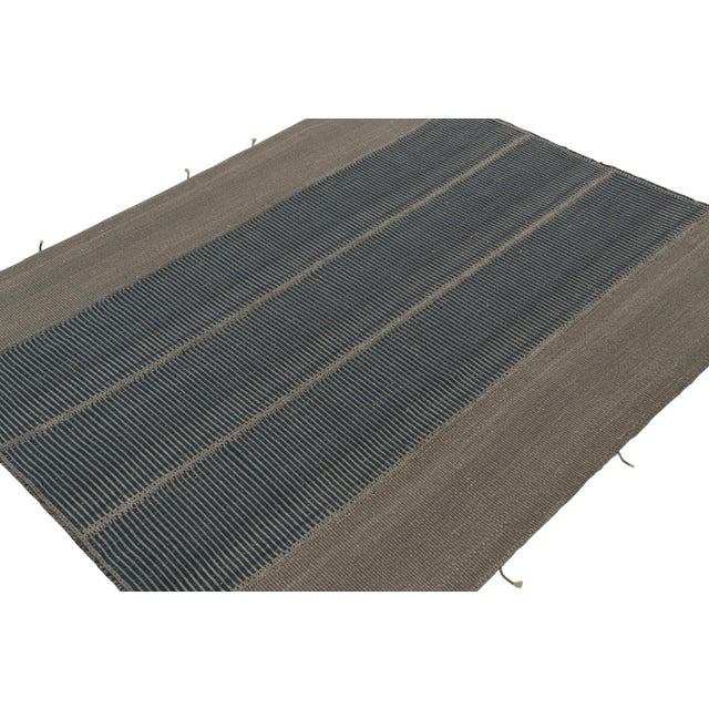 Handwoven in wool, an 8x10 Kilim in gray and blue accents, from a bold new line of contemporary flatweaves, ‘Rez Kilim’,...