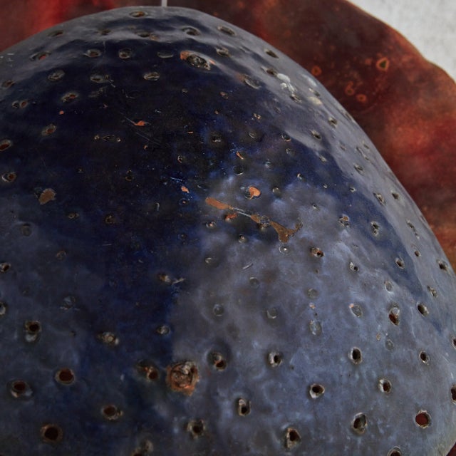 A rare French artisan made metal sconce from the 1950s. The sculptural, organic modern silhouette is composed of two...