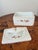 A beautifully detailed covered porcelain box by Meissen featuring a softly scalloped rectangular form accented with...