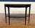 This is the Atlantic Demilune Console by Highland House Furniture. It features a rounded front with a lower shelf. It has...