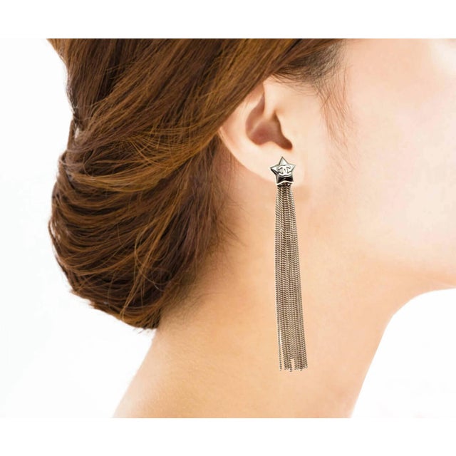 Chanel Silver CC Grey Shooting Star Silver Chain Tassel Long Dangle Clip on Earrings *Marked 17 *Made in France *Comes...