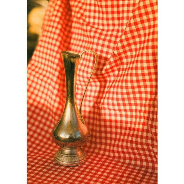 A classically inspired decorative vase made of chromed metal with a mirrored finish and elegant lines. The design combines...