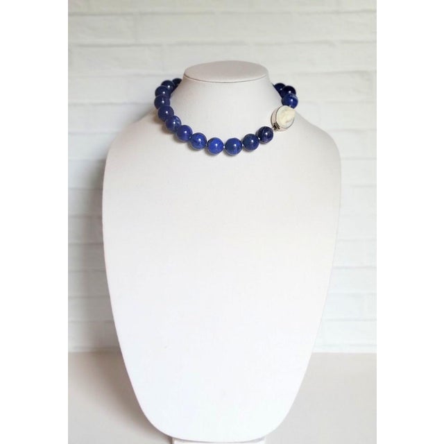 The necklace is 17 inches (43 cm) long, and the smooth round beads are 18 mm in size. Lapis lazuli is treasured the world...