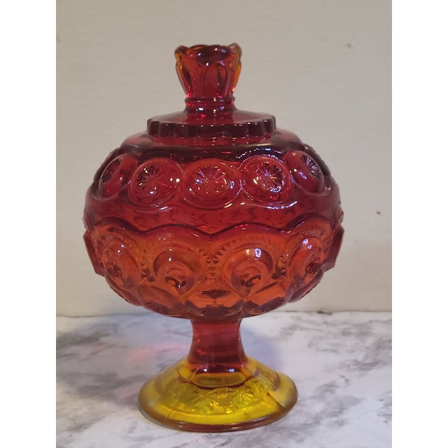 This gorgeous amberina transitions from firey red to and orange glow and a mellow yellow color. It has the classic lidded...