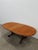 Authentic vintage mid century modern teak extendable dining table with built-in leaf. By G Plan. Maker's label on bottom...