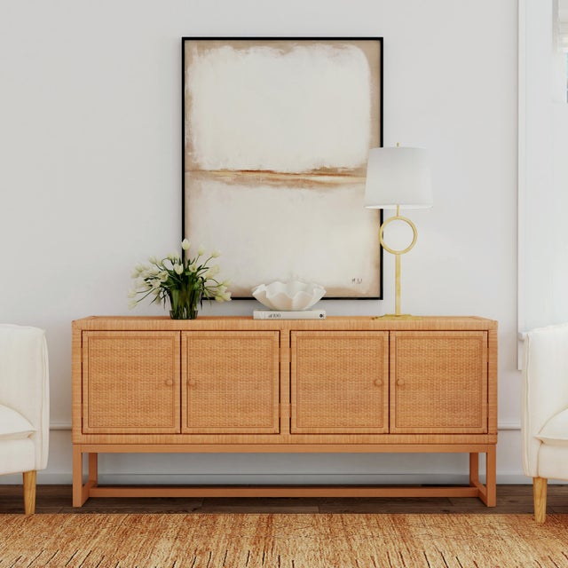 Introducing the Captiva Rattan 4-Door Sideboard, where coastal charm meets functional beauty. With its wood frame...