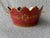 Vintage hand painted maroon and gold oval tole cachepot with a monteith top and two side handles. It measures...