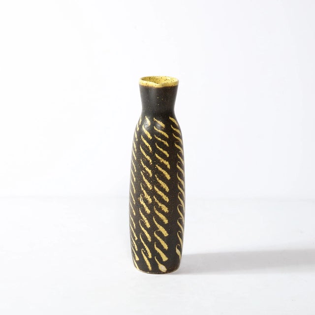 This boldly patterned Mid-Century Modernist Ceramic Vase Originates from the United States, Circa 1960. The body of the...