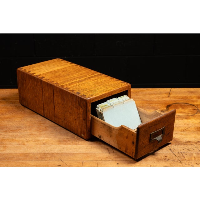 Wooden single card catalog with dovetail construction. This piece features a single drawer for housing various cards such...