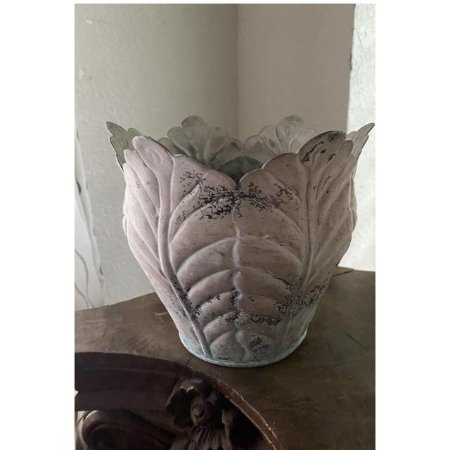 Not sure the age of age of this planter , does have patina changes on the inside . Outside is distress . Great addition to...