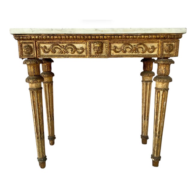 18th Century Italian Neoclassic Carved and Gilt Console Table with Sienna Marble Top. Table is rectangular in shape and...
