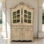 An antique Liegeoise Regence bookcase display cabinet of exceptional quality, hand stripped to reveal an antique patina of...