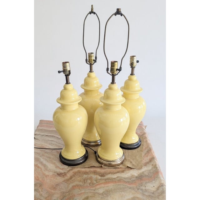Elevate your interior with this delightful collection of four vintage ginger jar table lamps, featuring a soft butter...