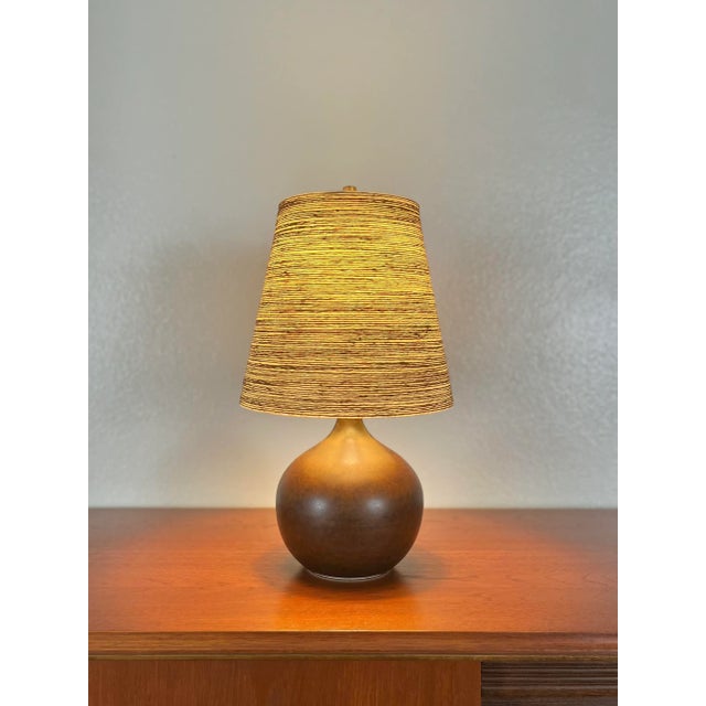 Ceramic Brown Bulb Table Lamp With Original Fiberglass Shade by Lotte and Gunnar Bostlund. Finished in a classic dark...