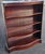 A Mid-20th Century Federal Style Solid Mahogany Medium Size Serpentine Bookcase. Comes with 3 adjustable shelves, all...