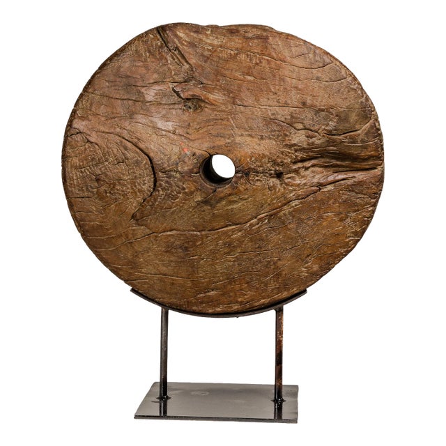 Ancient Rustic Cart Wheel Mounted on Black Lacquer Base, Weathered Patina For Sale