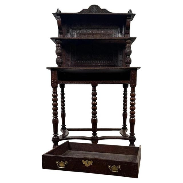 A highly decorative 19th-century English side table, finely crafted from oak and distinguished by its elaborate bobbin-...