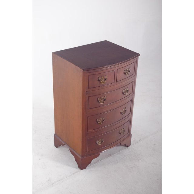 Bedside table with five drawers. Two small drawers are at the top next to the worktop, the three larger ones below, in a...