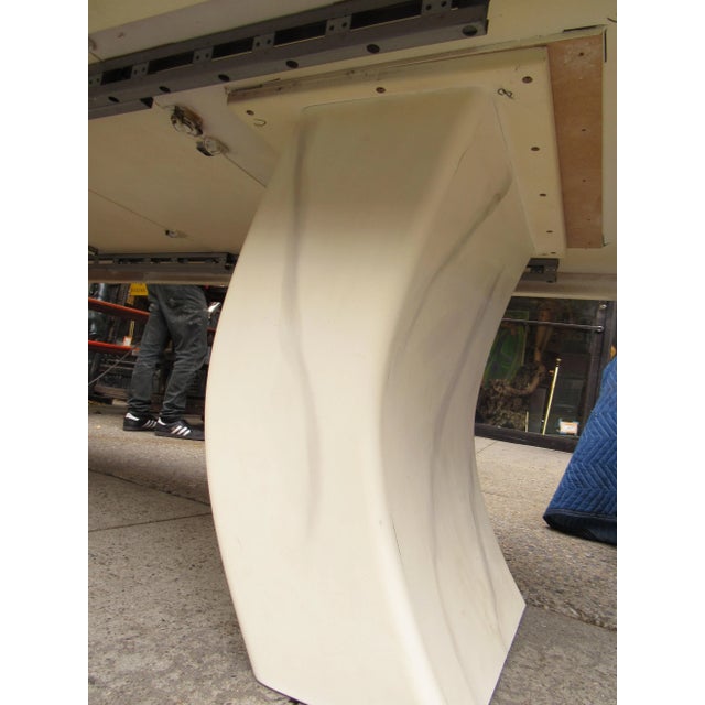 An elegant and impressive dining table styled after the designs of Karl Springer. A faux marble surface offers a unique...