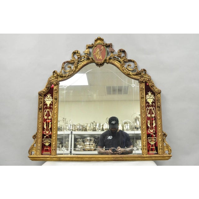 Antique French Neoclassical Baroque Style Gold Gilt Gesso Red Glass Frame Wall Mirror. Item features a figural cameo...