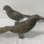 Pair of metal pheasants with long feather detail has a Hollywood Regency or Palm Beach style aesthetic. A rich accent for...