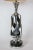 These tall, twisted table lamps are made of chrome. Up to 250V (Europe/UK Standard).The wiring of this item may be...