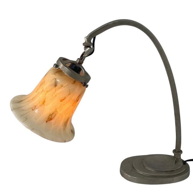 Art deco desk lamp with a metal base and marble like glass. This lamp has been rewired and refitted with an E14 socket....