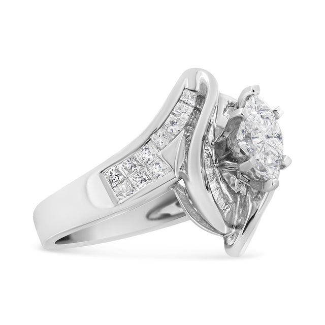 Bold and unique, this cocktail ring has an eye-catching swirl design in gleaming 14k white gold. The silver swirls frame a...