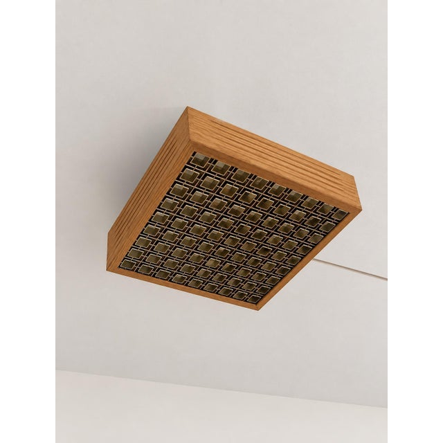 When lit, a warm and beautifully patterned glow emanates through the golden geometric grid — this is what makes the...