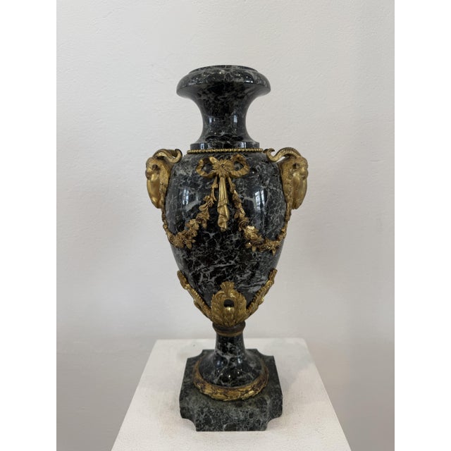 Ornamental vase in green marble and gilded bronze, 19th century, France. The distinctive feature of this model is the...