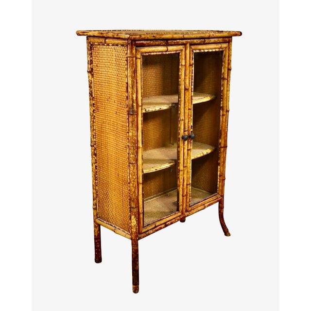 This is a charming c. 1880-1900 English glazed bamboo bookcase. The bookcase is in overall very good original condition....