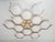 Italian midcentury flush mount with twelve matte white Murano glass shades mounted on solid brass frame in lacquered...